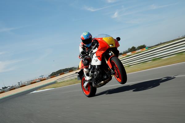 2024 Yamaha XSR900 GP on track pulling a wheelie