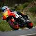 2024 Yamaha XSR900 GP riding past taking a right hand bend, pointing towards the camera