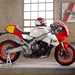 2024 Yamaha XSR900 GP static shot on paddock stand with helmet on tank