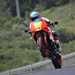 2024 Yamaha XSR900 GP on track facing the camera popping a wheelie